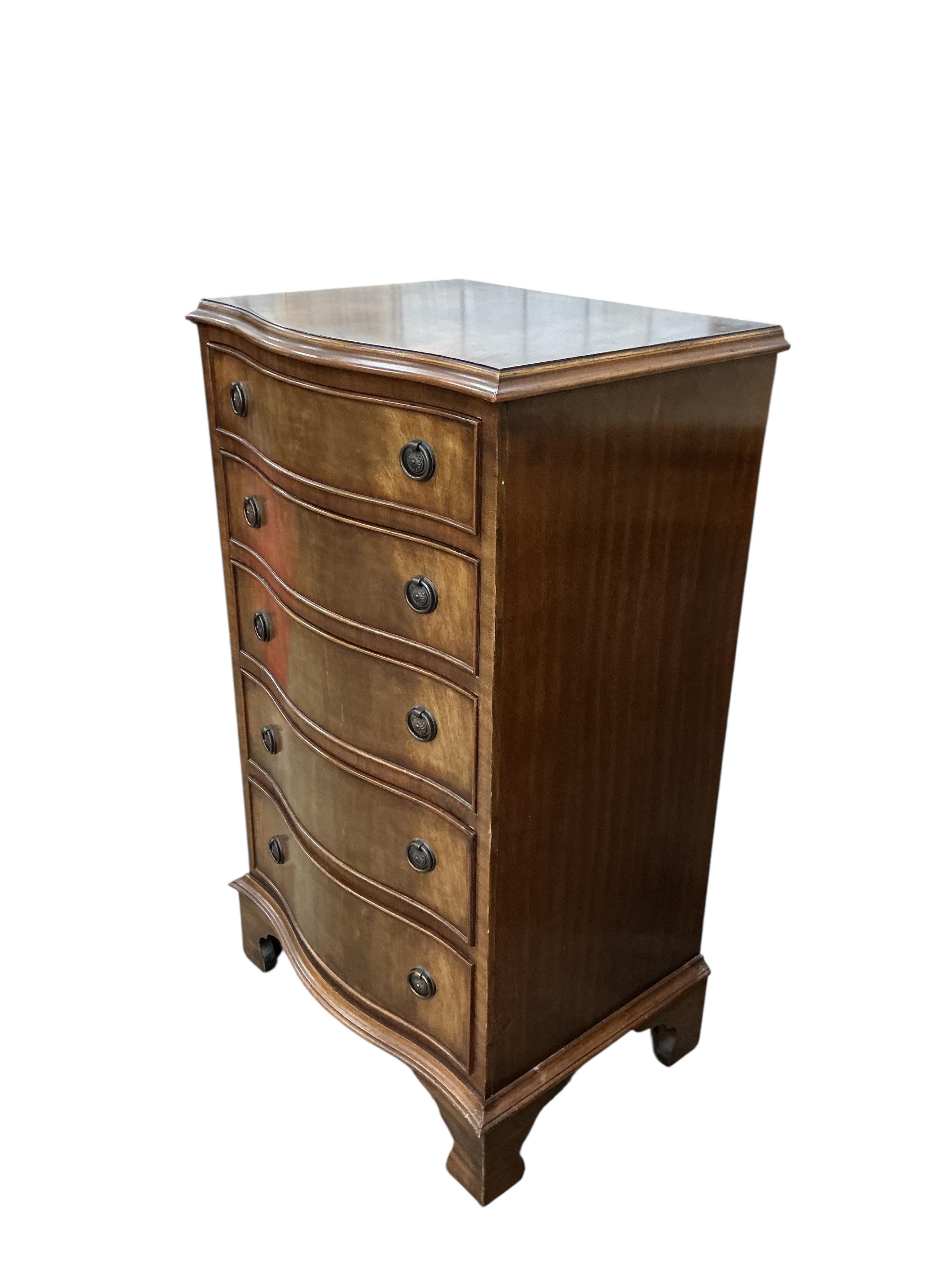 A reproduction George III style mahogany serpentine chest of five drawers, width 54cm, depth 41cm, height 92cm